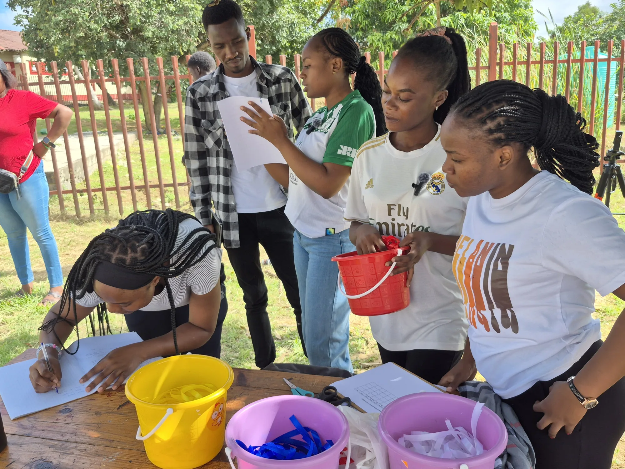 Image of students from Zambia setting up fundraising stall