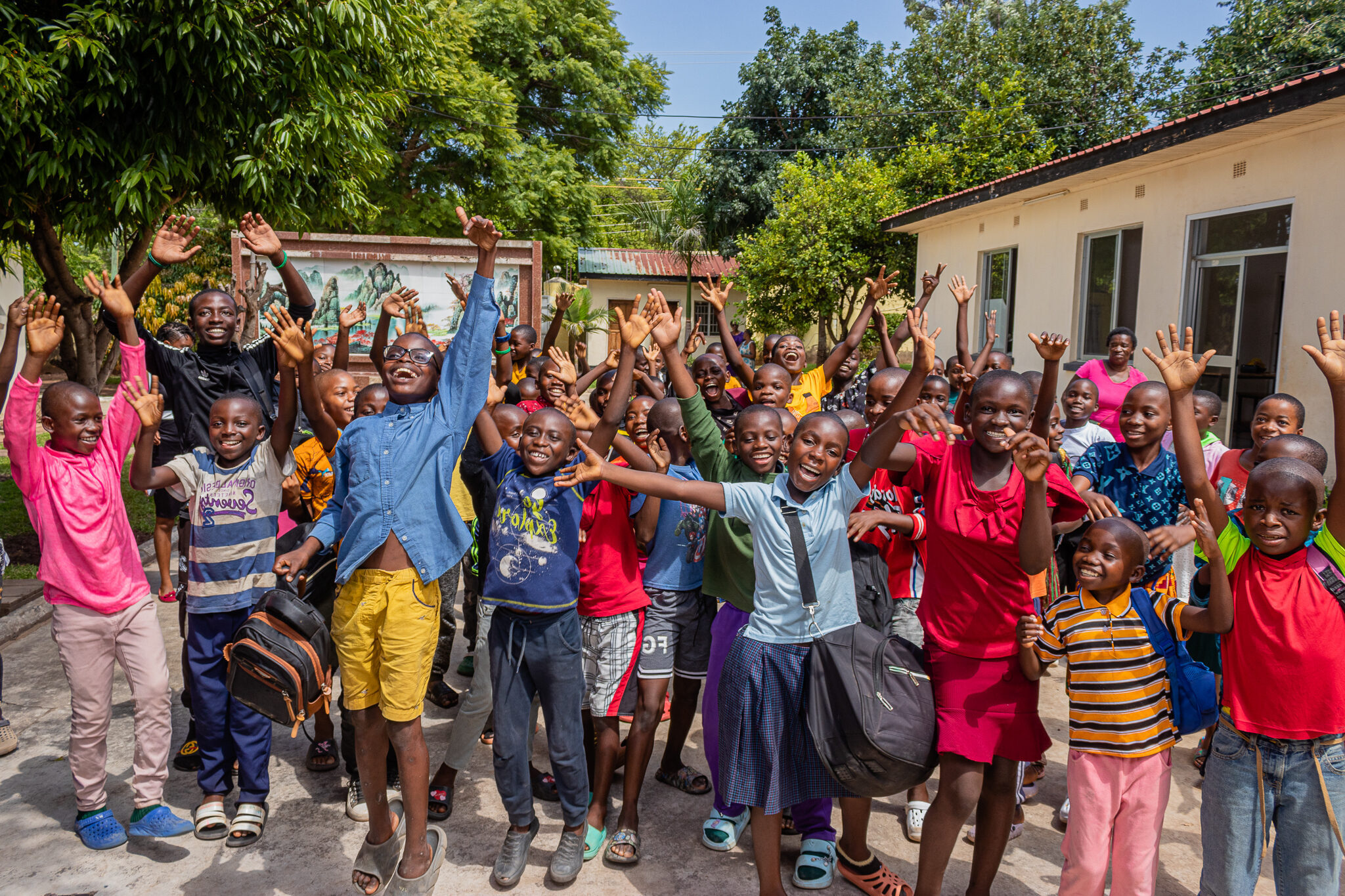 Group of cheering children at Pestalozzi International Zambia