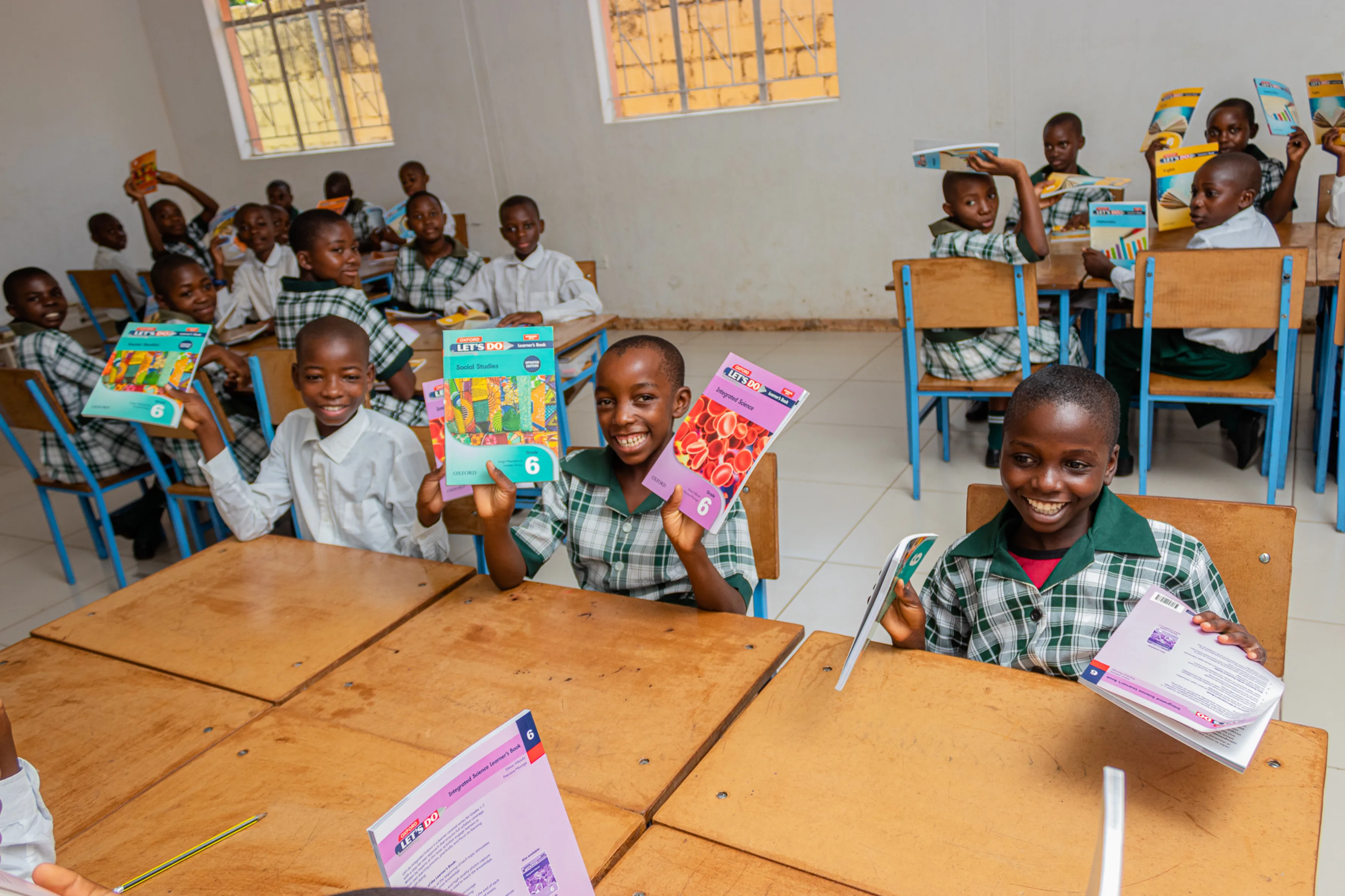 Children in class with their books at Pestalozzi Zambia