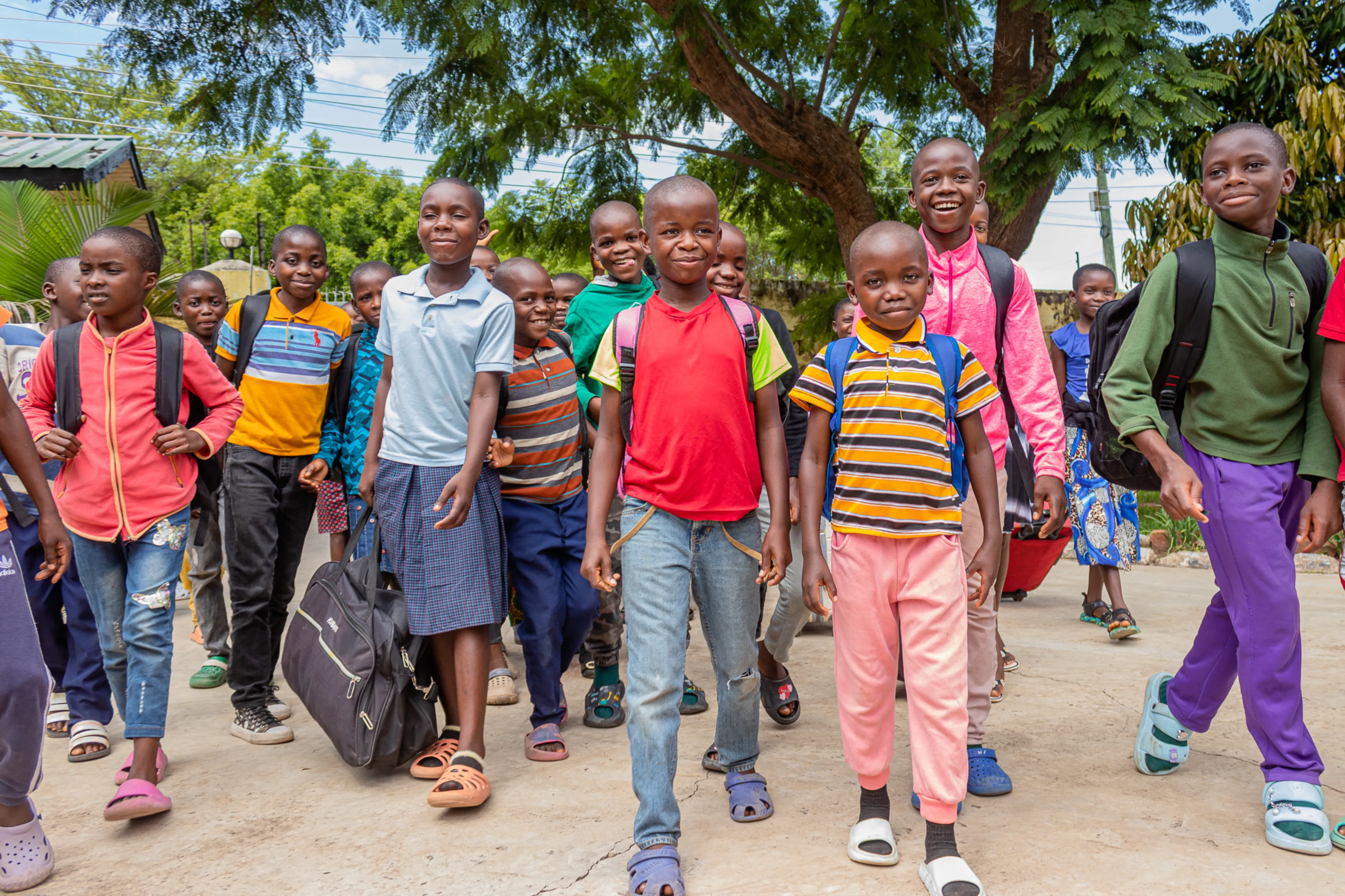 Group of children in Zambia walking towards us