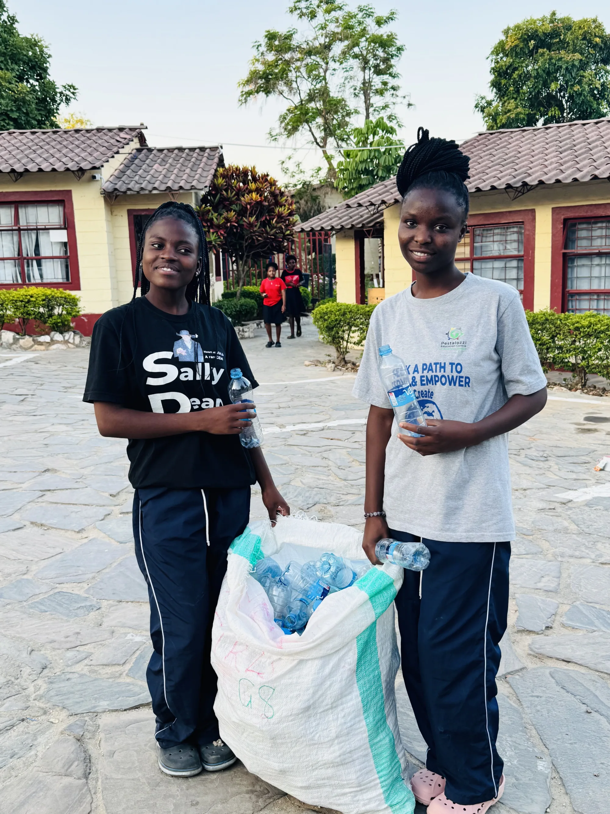 Juliet and Nelly raise funds for an orphanage by recycling plastic