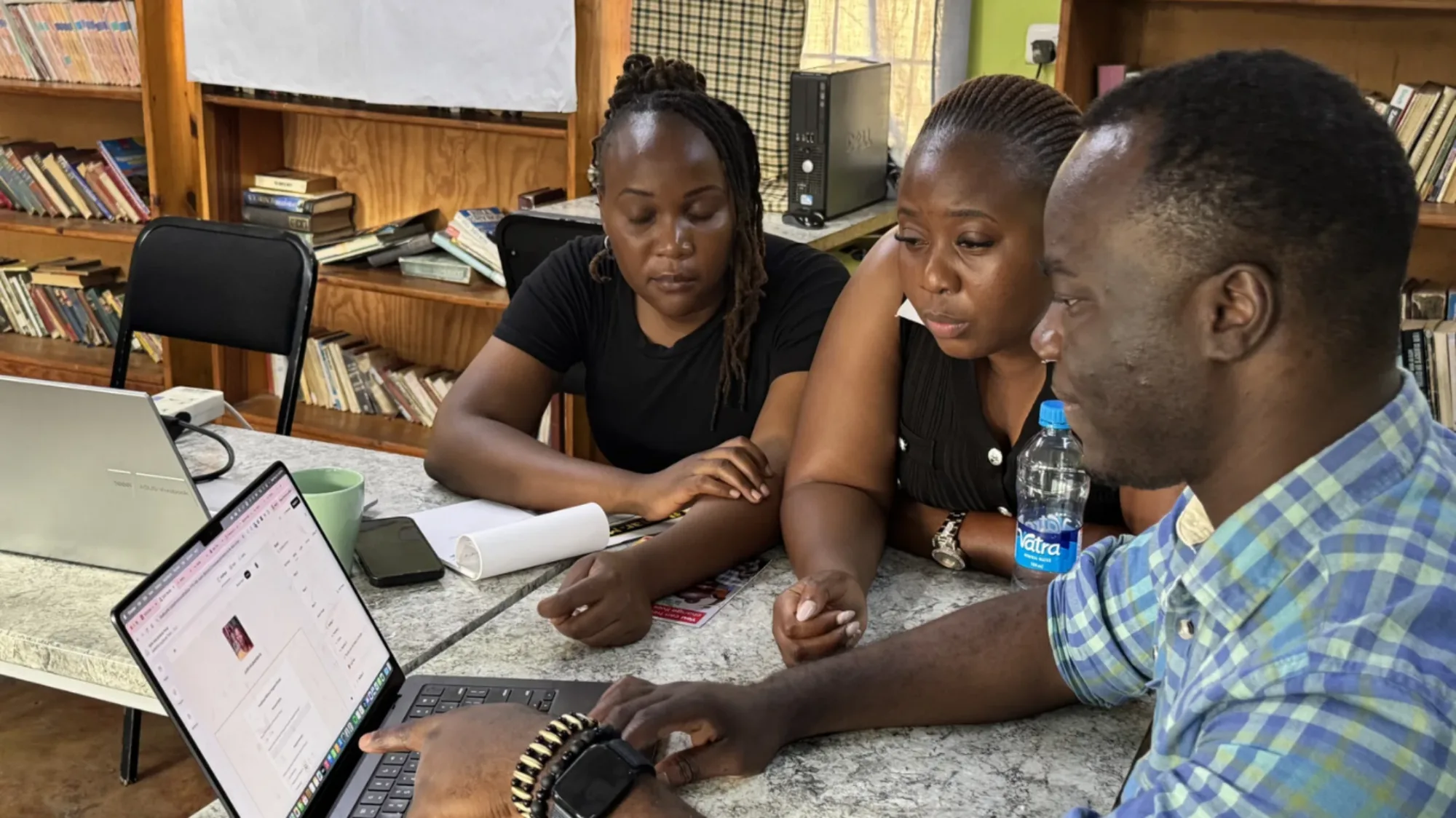 Thomas supporting staff in Zambia on IT systems