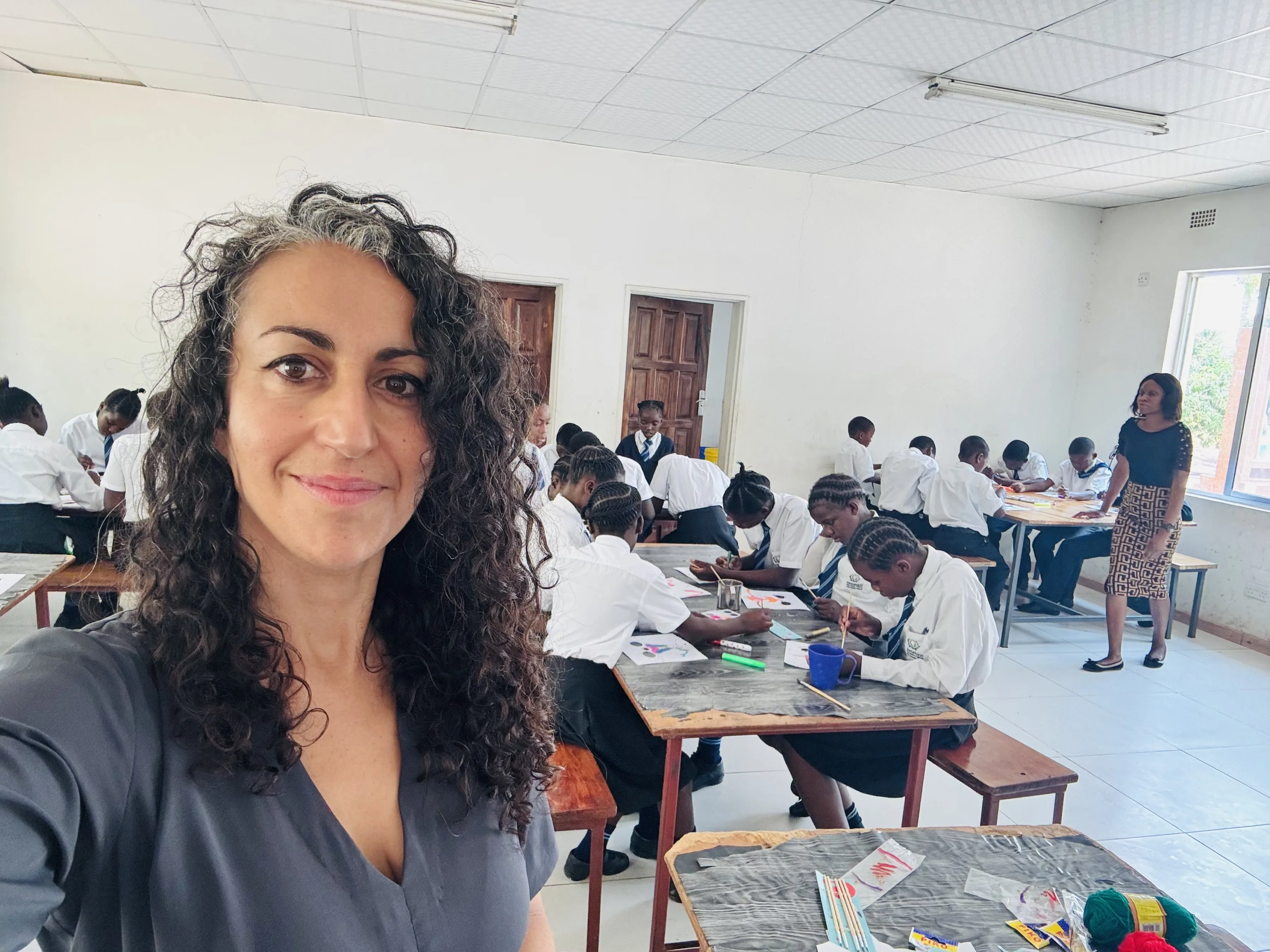 Staff Member from Pestalozzi International with Team Zambia, Smiling and standing together