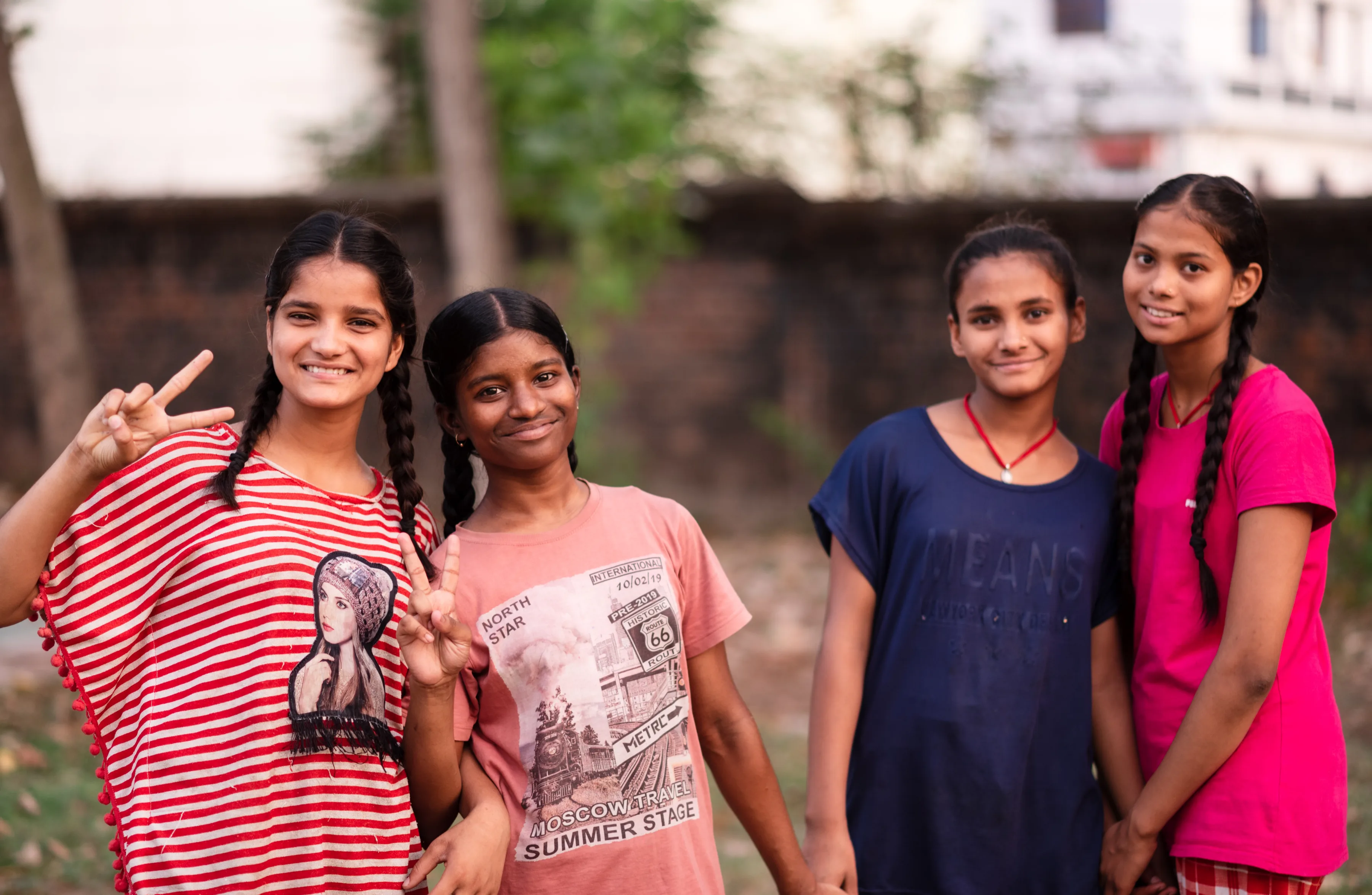 Image of 4 female students from Pestalozzi India on the playground