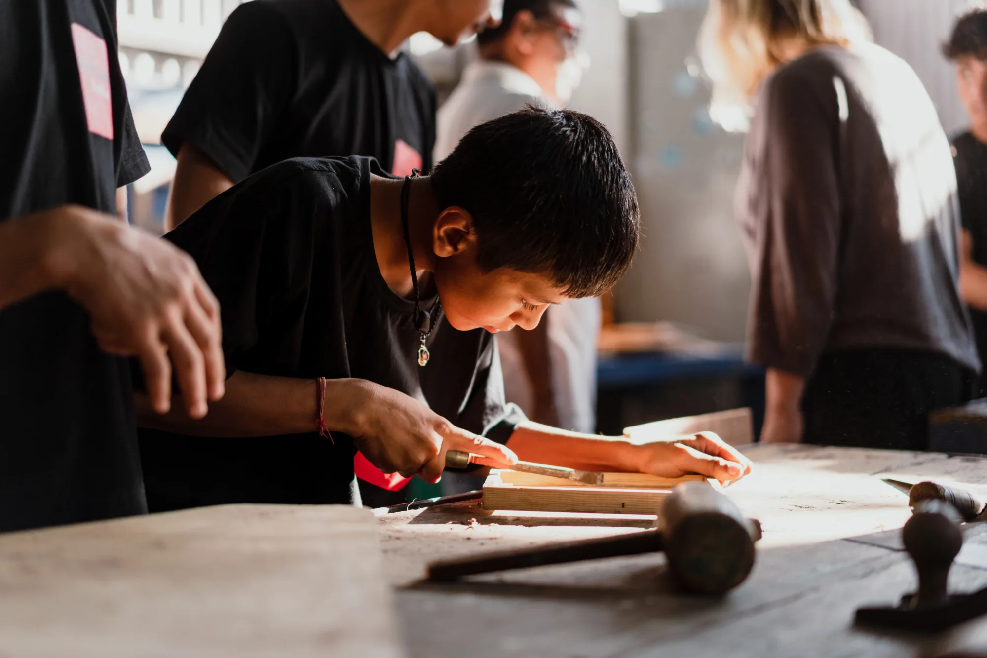 Indian children working with wood